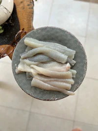 fish fillets on a plate on a table