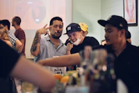 a group of people drinking at a bar
